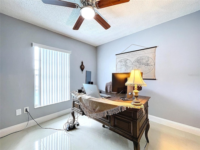 carpeted office space featuring ceiling fan and a textured ceiling