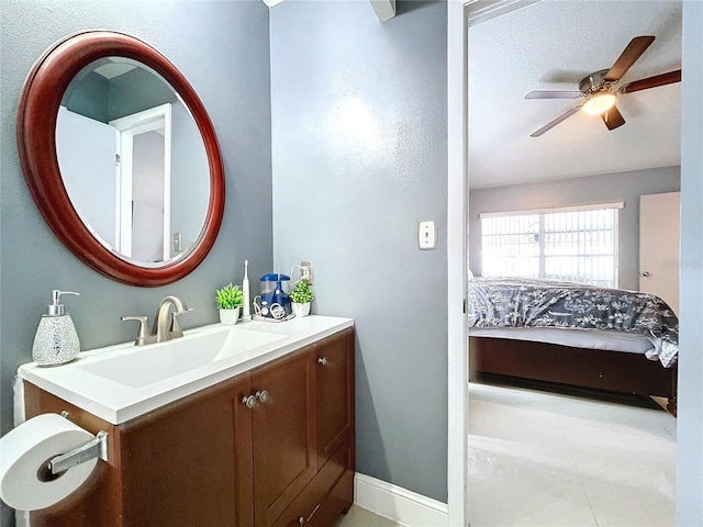 bathroom featuring vanity, tile patterned floors, and ceiling fan