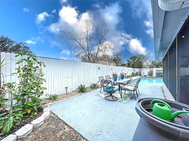 view of patio / terrace featuring a fenced in pool