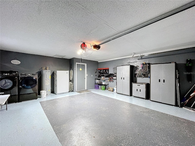 garage featuring a garage door opener, white refrigerator, water heater, and washing machine and clothes dryer