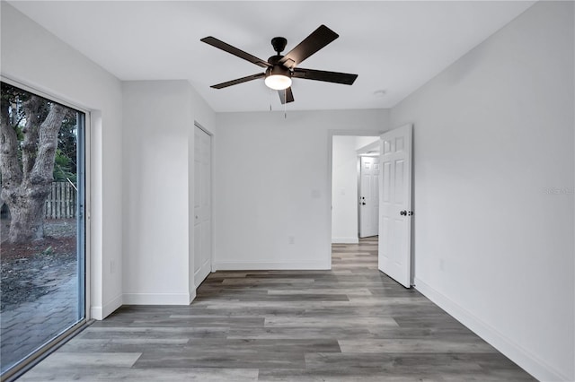 interior space featuring access to exterior, ceiling fan, and hardwood / wood-style floors