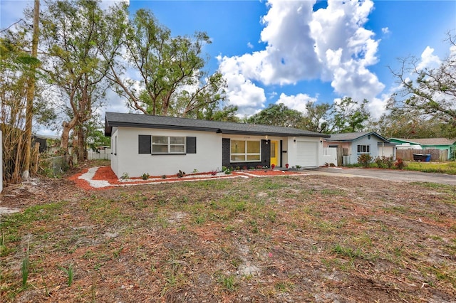 single story home with a garage