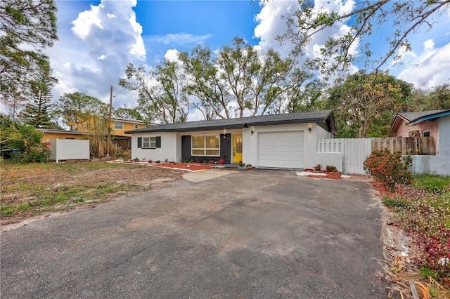 ranch-style house featuring a garage