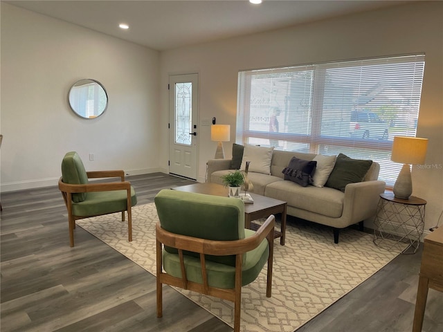 living area featuring dark wood-style floors, baseboards, and recessed lighting