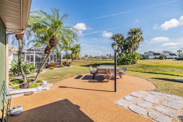 view of patio / terrace featuring a lanai