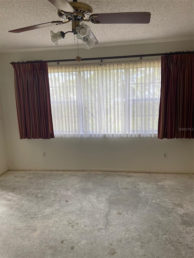 empty room featuring a textured ceiling