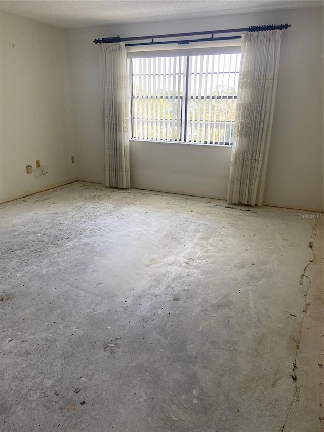 empty room with a textured ceiling