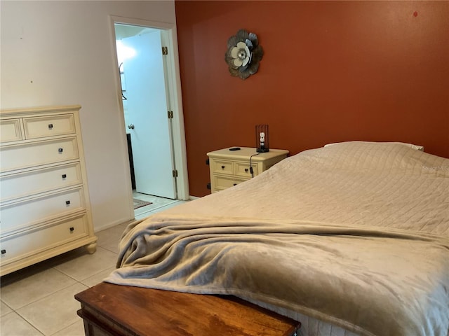 bedroom with light tile patterned floors