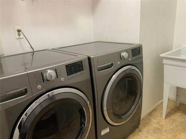 washroom with independent washer and dryer