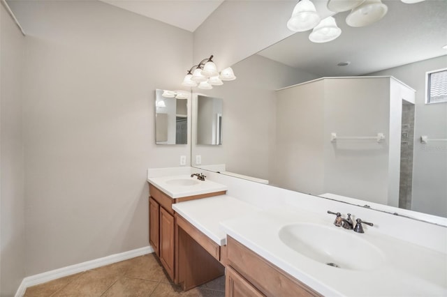 bathroom featuring tile patterned floors, vanity, and walk in shower