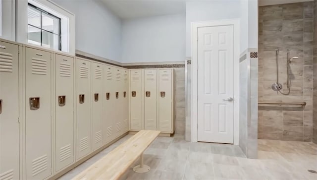 mudroom featuring tile walls