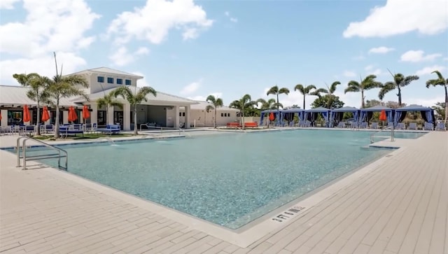 view of swimming pool featuring a patio area