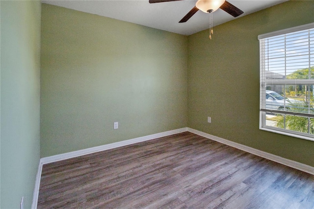 spare room with wood-type flooring and ceiling fan