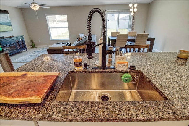 interior details with ceiling fan and sink