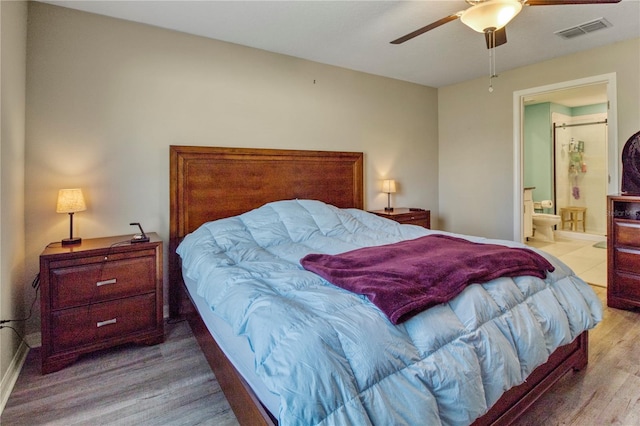 bedroom featuring connected bathroom, ceiling fan, and light hardwood / wood-style floors