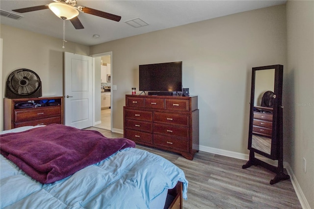 bedroom featuring light wood-type flooring and ceiling fan