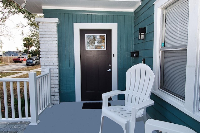 property entrance with covered porch