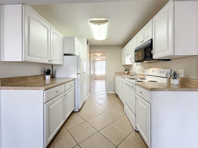 kitchen featuring light tile patterned floors, white appliances, white cabinetry, and sink