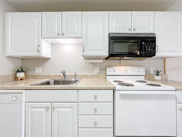 kitchen featuring white cabinetry, white appliances, and sink