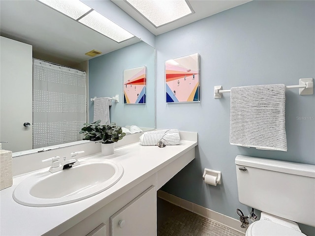 bathroom with vanity and toilet