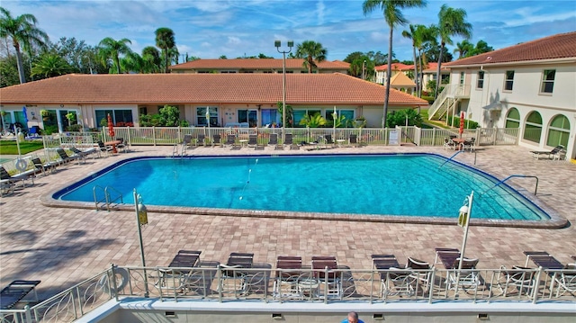 view of swimming pool with a patio area