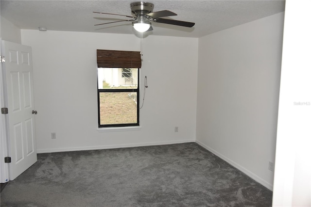 empty room featuring baseboards, a ceiling fan, a textured ceiling, and carpet flooring