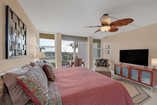 bedroom featuring ceiling fan and access to outside