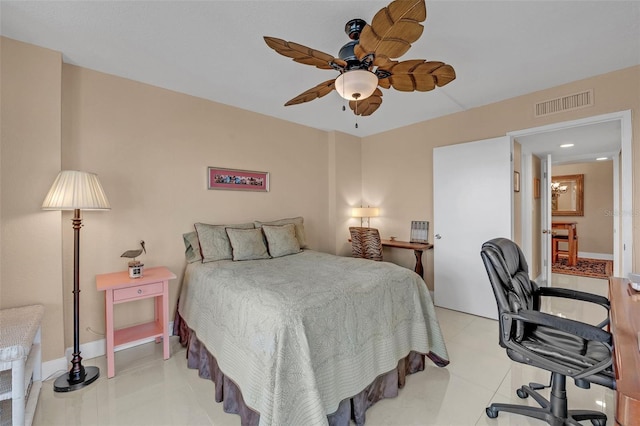 bedroom with ceiling fan and light tile patterned flooring