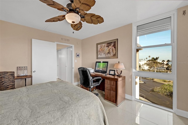 tiled bedroom with ceiling fan