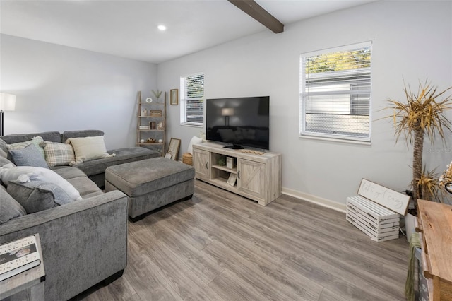 living room with dark hardwood / wood-style flooring and beamed ceiling