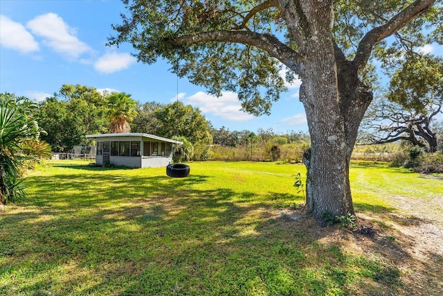 view of yard featuring a sunroom