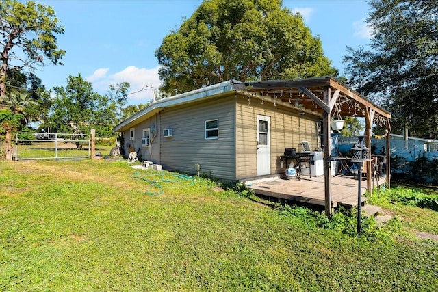 exterior space with a wooden deck and a yard