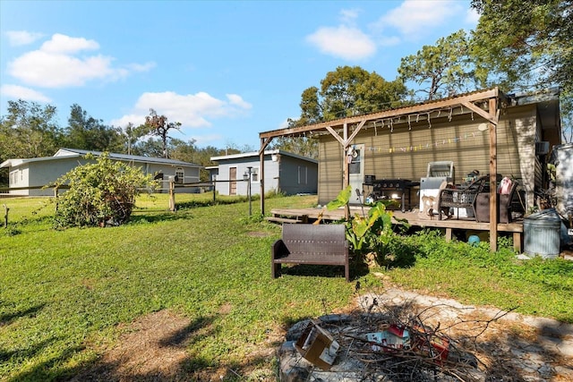 view of yard with a wooden deck