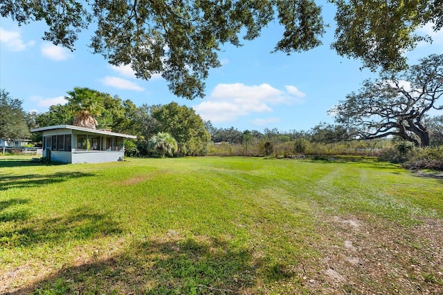 view of yard featuring a sunroom