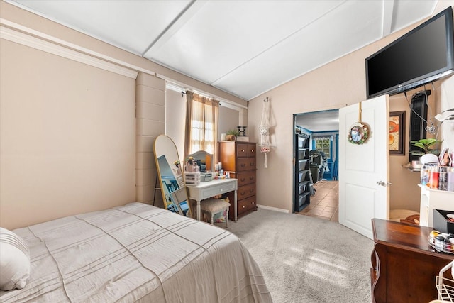 bedroom featuring carpet flooring and lofted ceiling