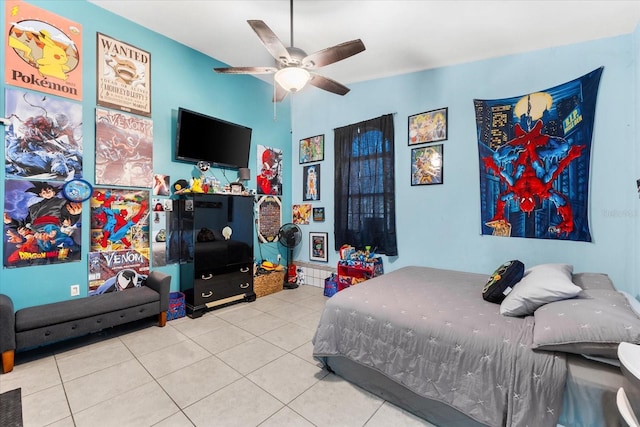 tiled bedroom featuring ceiling fan