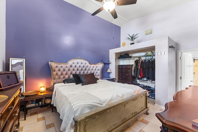 bedroom featuring a closet, high vaulted ceiling, and ceiling fan