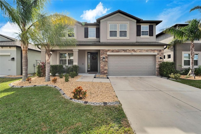 view of front of home featuring a front yard and a garage