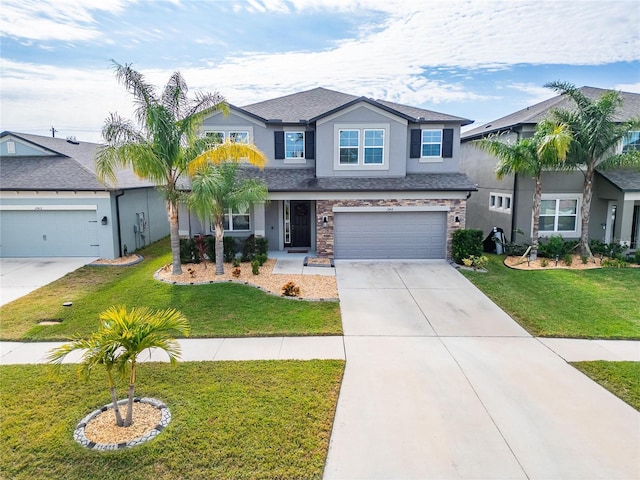 view of front of home featuring a garage and a front lawn