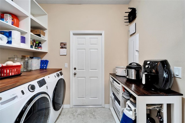 washroom featuring washer and dryer