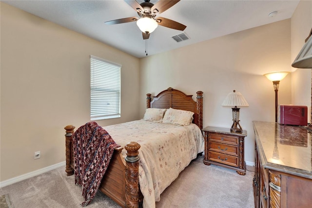 bedroom with light colored carpet and ceiling fan