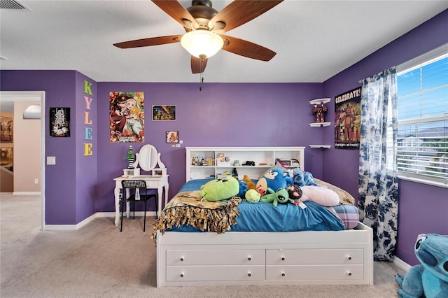 carpeted bedroom featuring ceiling fan