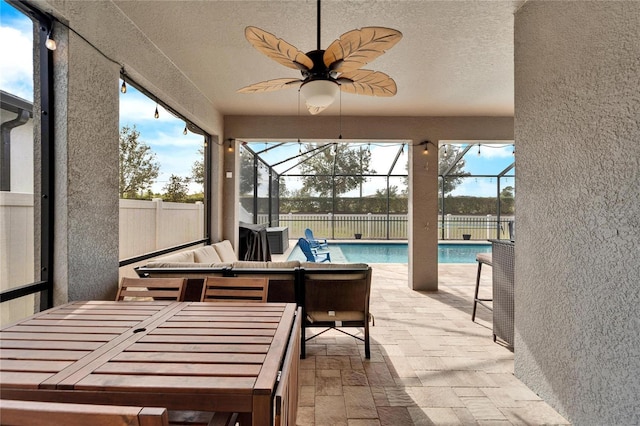 sunroom / solarium with ceiling fan