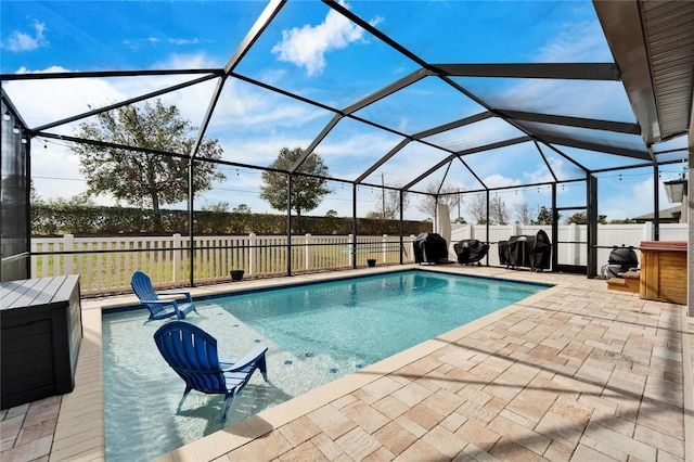 view of pool featuring a patio area and a lanai