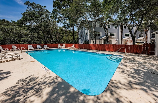 view of pool featuring a patio area