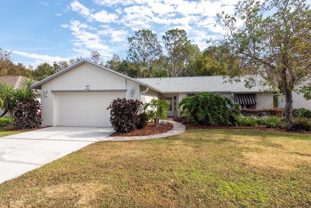 ranch-style home featuring a garage and a front lawn