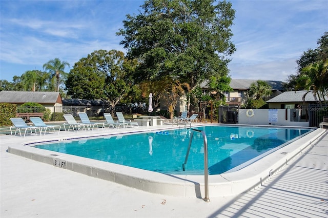 view of swimming pool with a patio