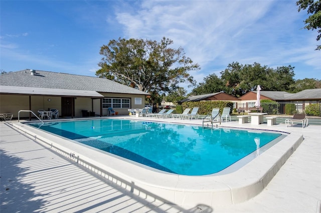 view of swimming pool featuring a patio