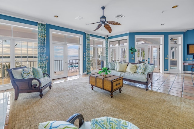 tiled living room featuring french doors, ceiling fan, and crown molding