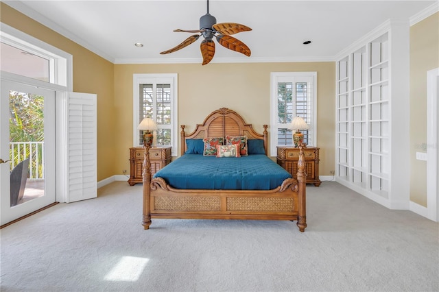 carpeted bedroom with access to exterior, ceiling fan, and ornamental molding